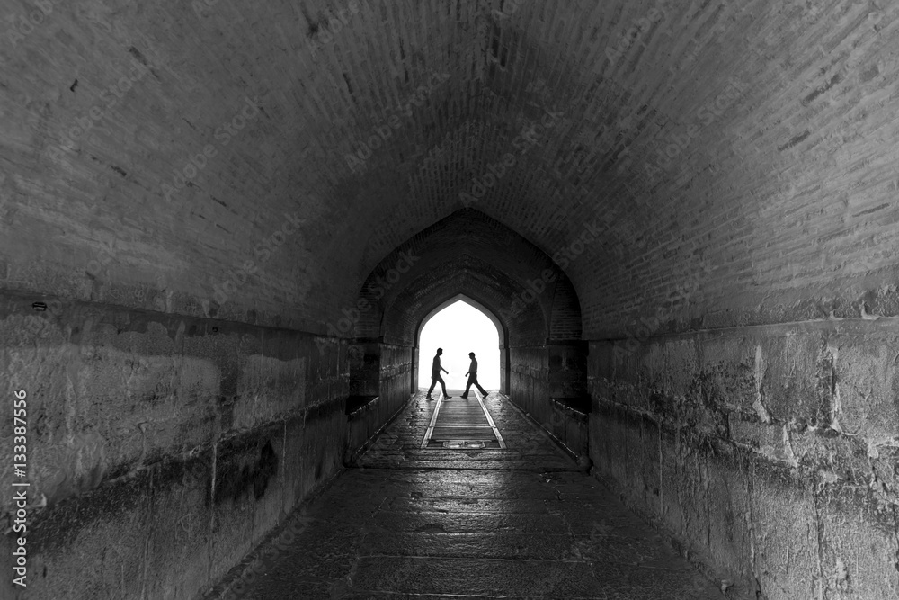 Perspective View Through a Dark Tunnel With Human Silhouette