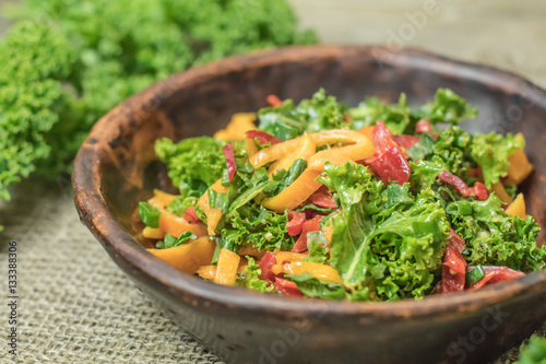Fresh healthy raw nutritional salad with organic curly kale gree
