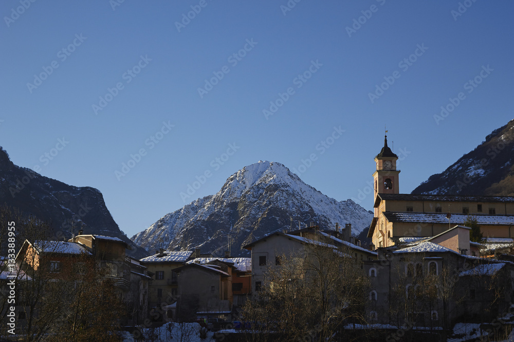 The Italian Maratime Alps with a local church at Entracque, Cuneo, Piemonte, Italy. The chuch in the foreground is in the village of Entracque.