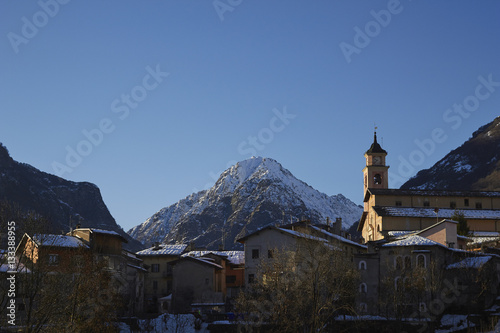 The Italian Maratime Alps with a local church at Entracque, Cuneo, Piemonte, Italy. The chuch in the foreground is in the village of Entracque.