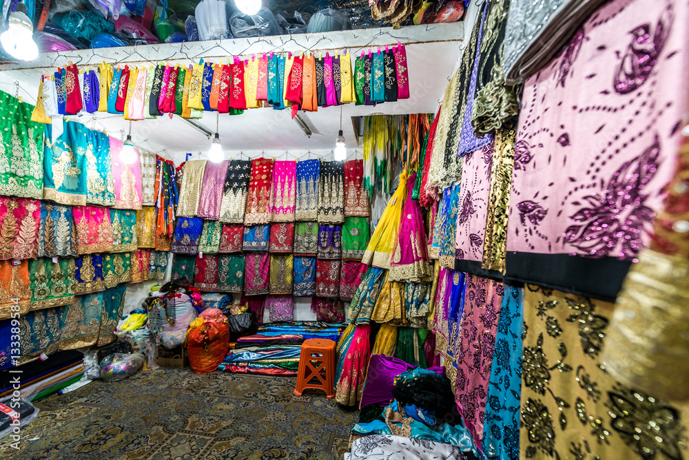 Fototapeta Fabrics and clothes shop on bazaar in Shiraz city in Iran