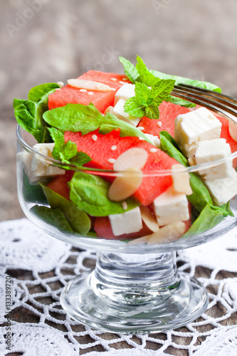 Salad with fresh watermelon and feta with basil and spinach lea