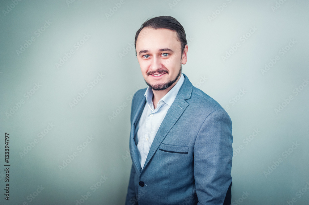 Portrait of a young businessman on grey background Portrait of a young businessman on grey background
