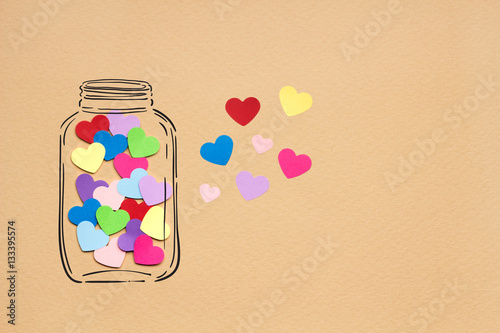 Bottled up inside / Creative valentines concept photo of hearts in illustrated bottle on brown background. photo