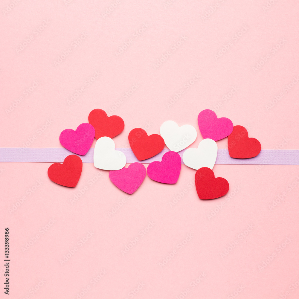 Valentine card / Creative valentines concept photo of hearts made of paper on pink background.