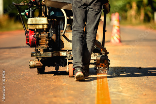 Asphalt road marking paints and striping with thermoplastic spray.