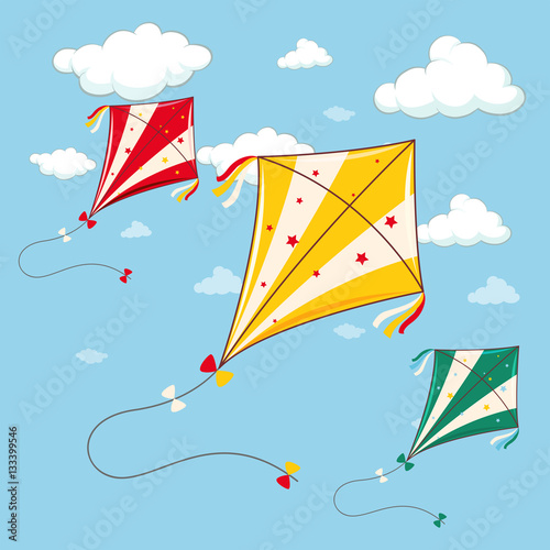 Three colorful kites in the blue sky