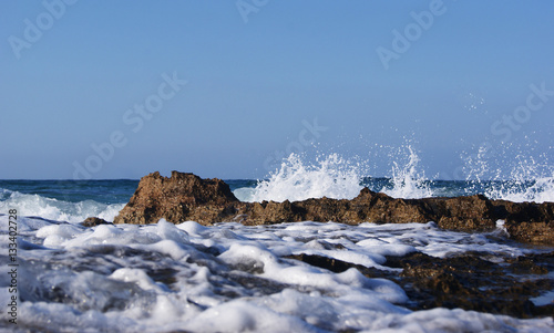 White foamy water and brown rocks