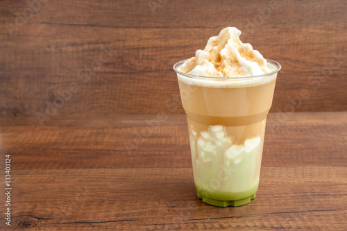 Obraz na płótnie Matcha and espresso frappe in the plastic glass on wooden background w salonie