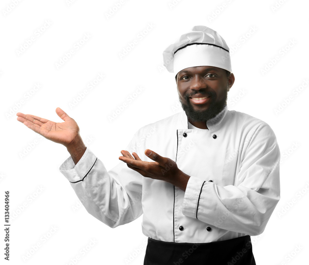 African American chef in uniform on white background
