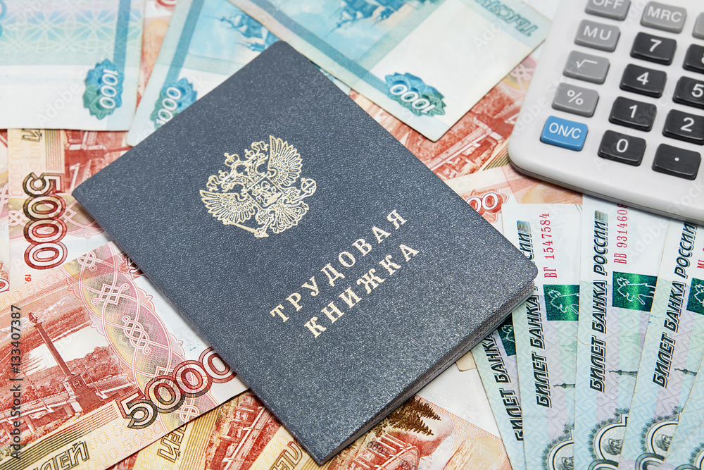 Work-book and calculator on the background of Russian money / Ru Work-book and calculator on the background of Russian money / Ru