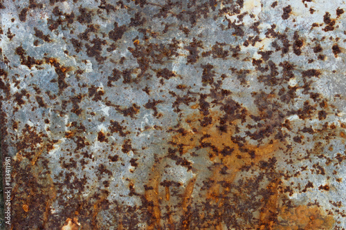 A rusty metallic wall in a rural home