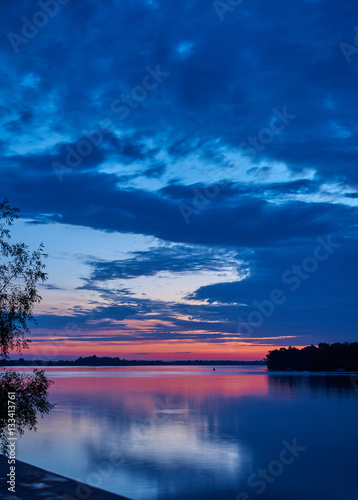 Landscape. Dawn over the broad river