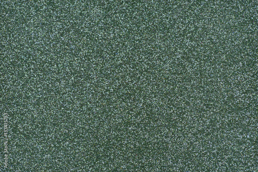 Glittery texture. Shining background. Green glitter Glittery texture. Shining background. Green glitter