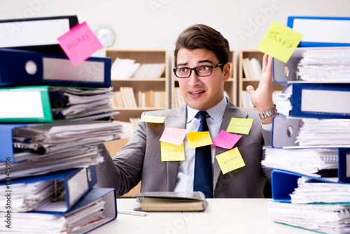 Businessman struggling with multiple priorities