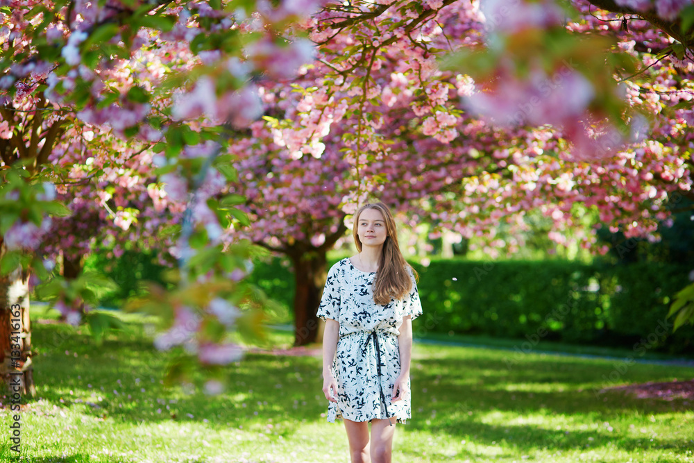 Beautiful young woman in blooming spring park Beautiful young woman in blooming spring park