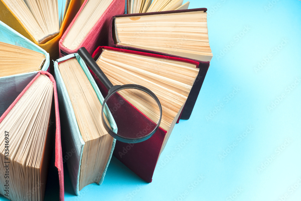 Fototapeta premium Top view of bright colorful hardback books in a circle.