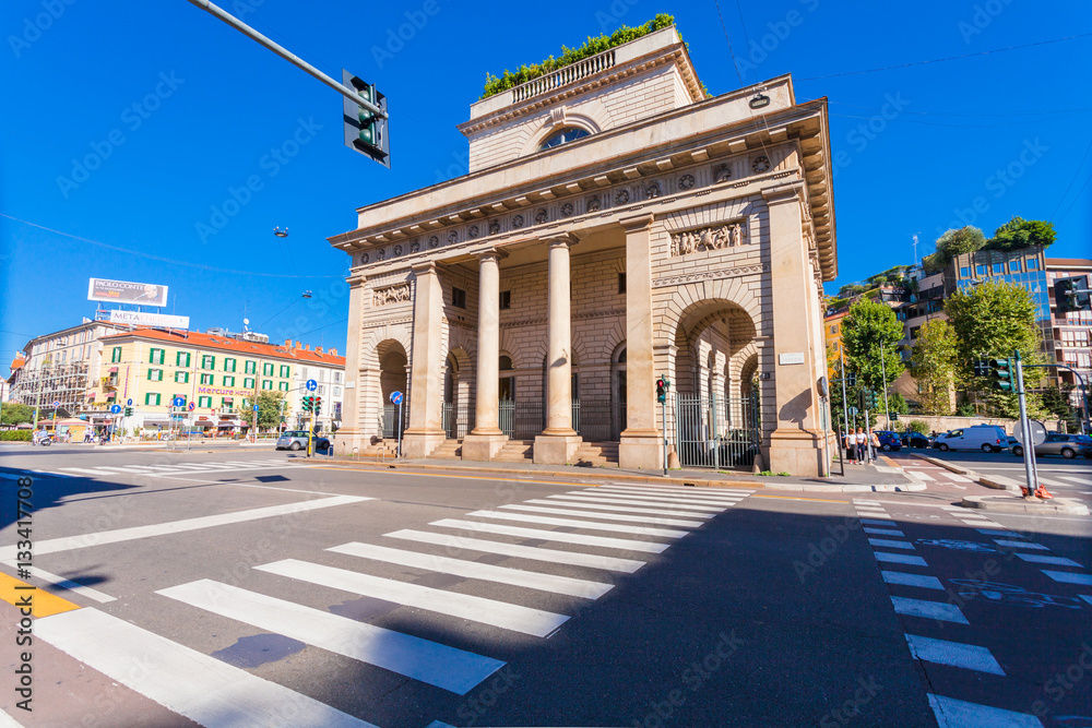 Fototapeta premium A street view of beautiful historic landmark - Porta Venezia (crossroad on Avenue Buenos Aires and street Bastioni di Porta Venezia)