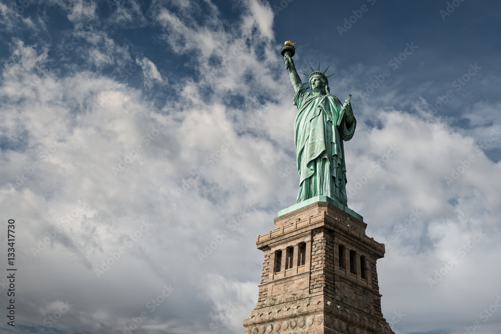 Fototapeta premium Statue of Liberty with white cloudy sky, New York