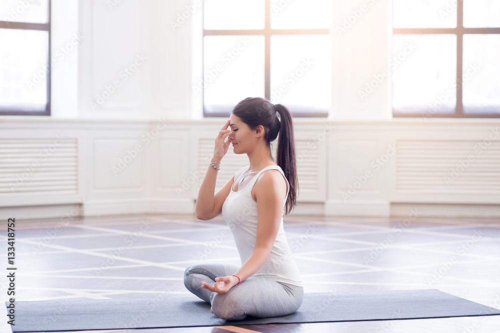 Yoga girl on fitness class background practicing Yoga girl on fitness class background practicing