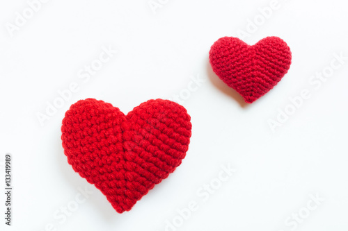 Crochet hearts on white background. Valentine's Day. Symbol of love.