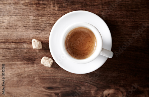 Cup of espresso on rustic wooden background