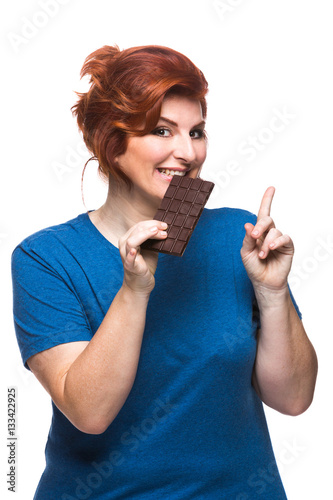 curvy woman eating chocolate