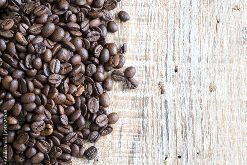 coffee beans on wooden table background