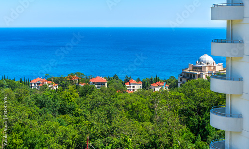 Cottage with red roofs on the seashore © den781