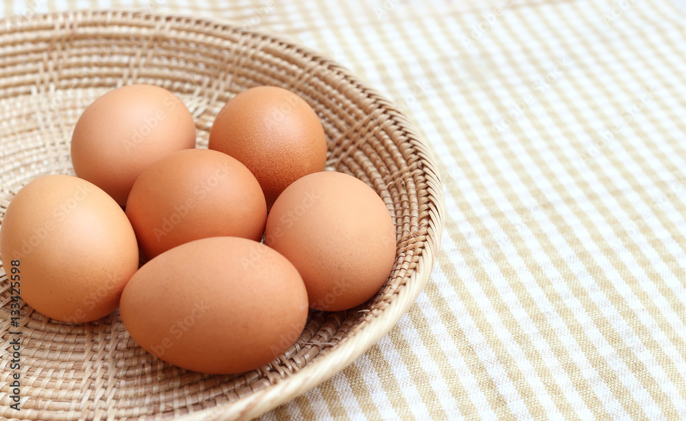 Close up Eggs Chicken on wooden basket Close up Eggs Chicken on wooden basket