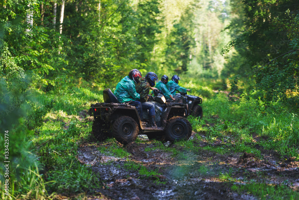 Fototapeta premium Summer Activities for adults - a trip on quad bikes on the dirty road. 