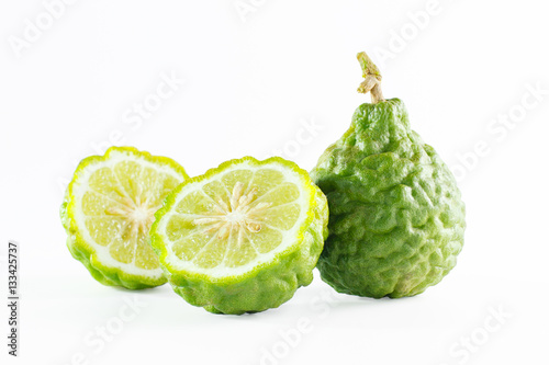 Green rough peel bergamot fruit or kaffir lime isolated on white
