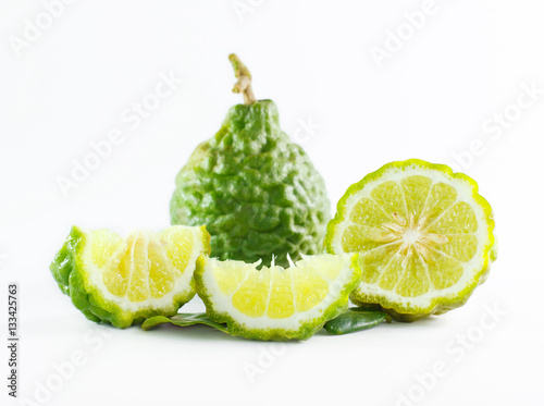 Green rough peel bergamot fruit or kaffir lime isolated on white