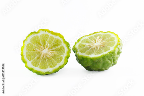 Green rough peel bergamot fruit or kaffir lime isolated on white