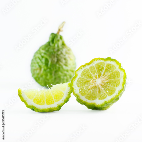 Green rough peel bergamot fruit or kaffir lime isolated on white
