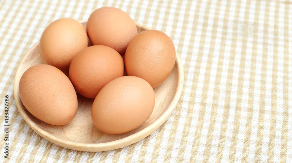 Close up Eggs Chicken on wooden plate 2 Close up Eggs Chicken on wooden plate 2