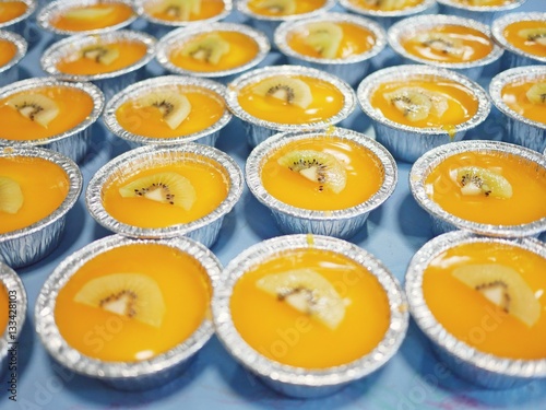 Many cups of orange cake.