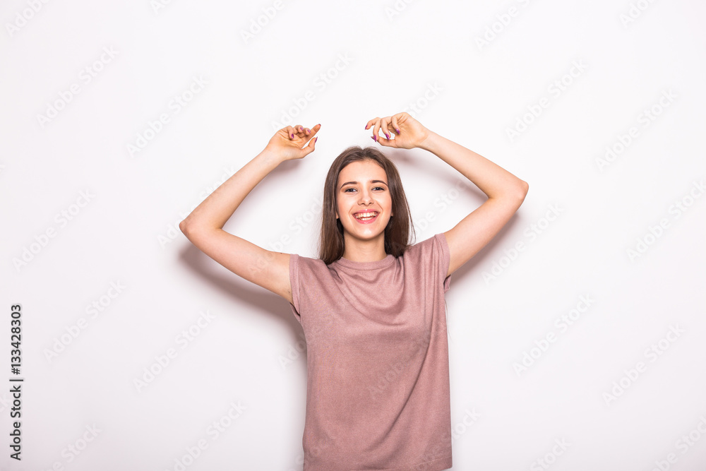Young beautiful girl with rised hands on white Young beautiful girl with rised hands on white