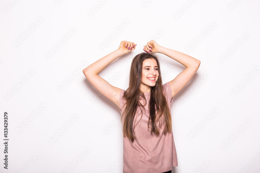 Young beautiful girl with rised hands on white Young beautiful girl with rised hands on white