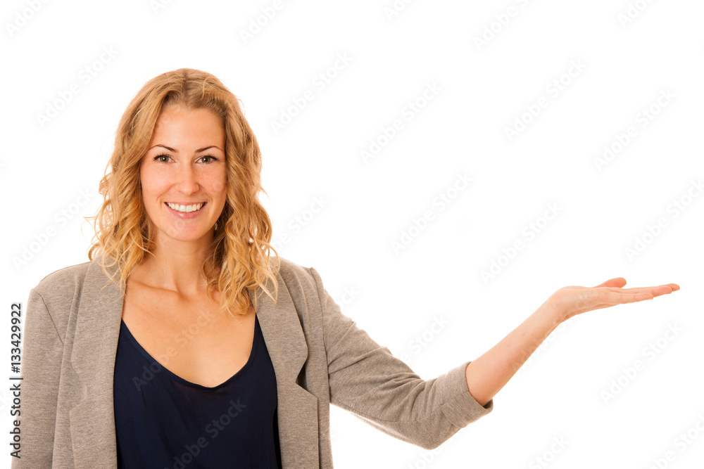 Woman holding arm over copy space as she is advertising a produc Woman holding arm over copy space as she is advertising a produc
