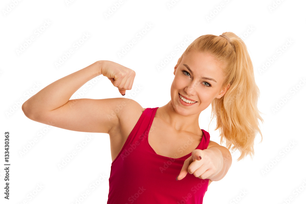 Cute young woman gestures power isolated over white background Cute young woman gestures power isolated over white background
