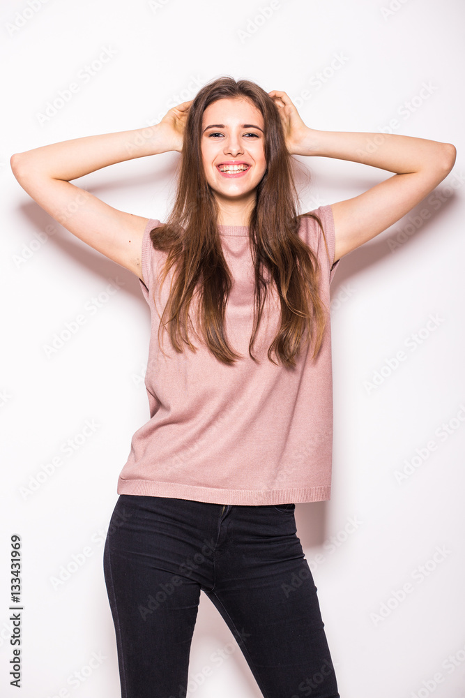 Young beautiful girl with rised hands on white Young beautiful girl with rised hands on white