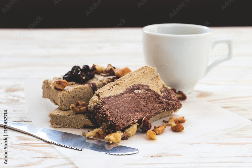 Marble sesame halva with cocoa and cup of coffee Marble sesame halva with cocoa and cup of coffee