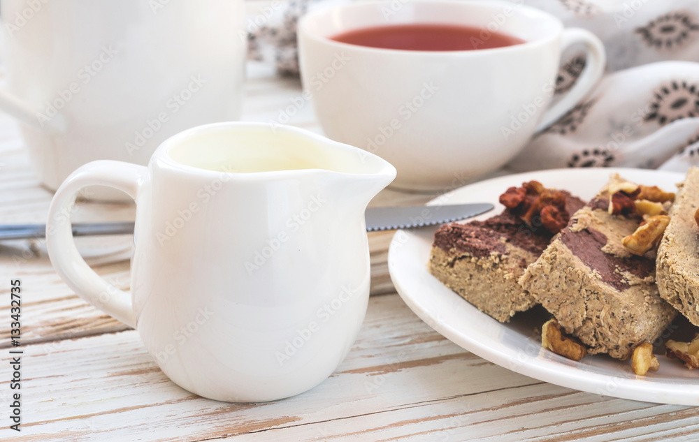 Marble sesame halva with cocoa and cup of tea Marble sesame halva with cocoa and cup of tea