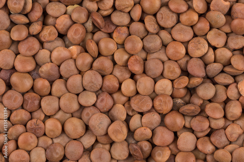 Picture of brown lentils over flat surface
