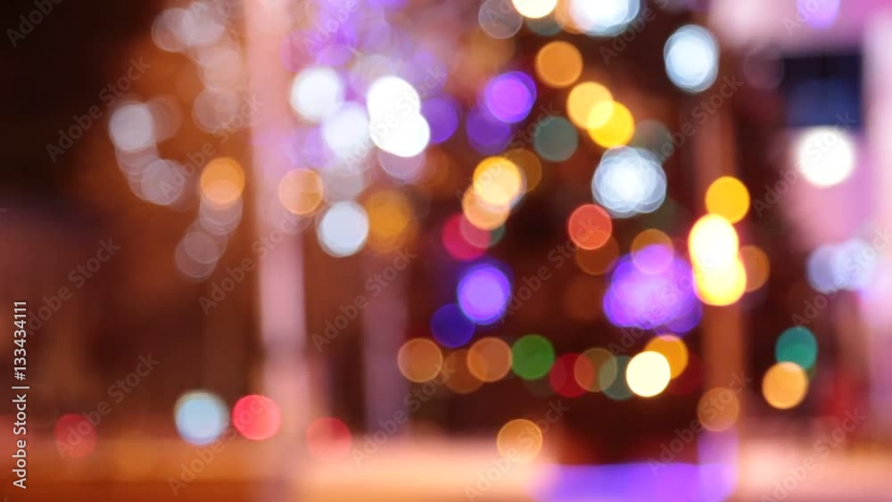 Christmas tree with colorful bokeh and christmas lights..Christmas and new year decoration. Abstract bokeh holiday background. Blinking garland. Christmas lights twinkling. Christmas tree with colorful bokeh and christmas lights..Christmas and new year decoration. Abstract bokeh holiday background. Blinking garland. Christmas lights twinkling.