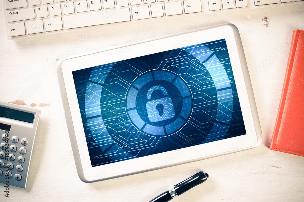 Web security and technology concept with tablet pc on wooden tab Web security and technology concept with tablet pc on wooden tab
