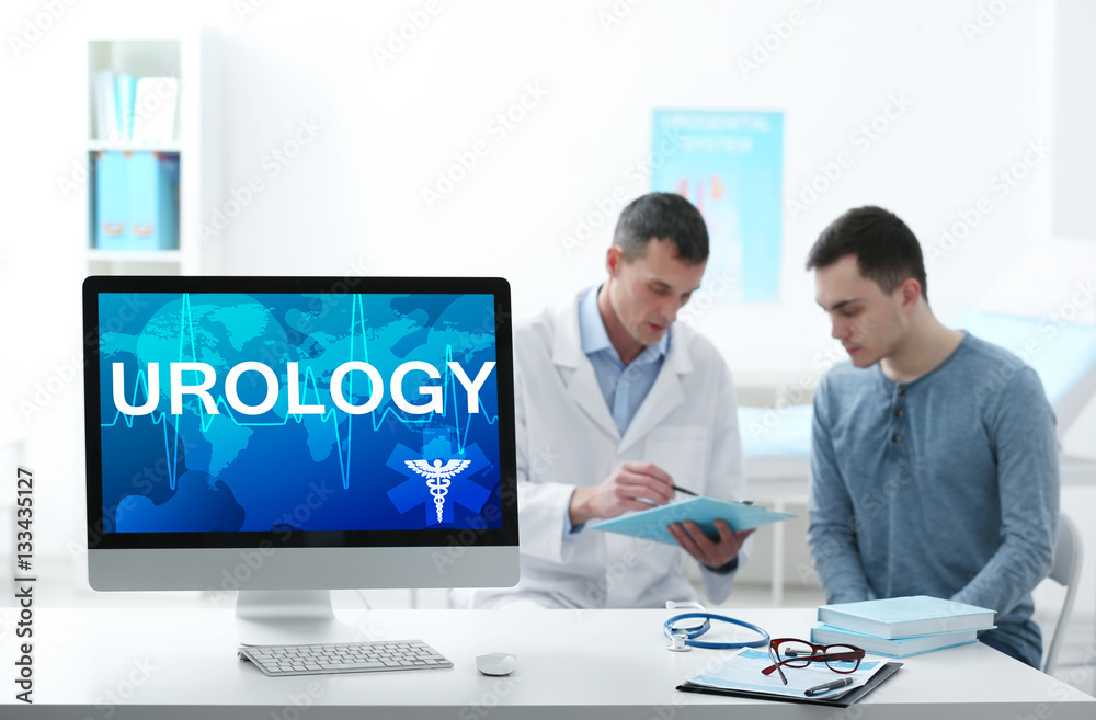 Modern computer on table. Word UROLOGY on screen. Health care concept. Modern computer on table. Word UROLOGY on screen. Health care concept.