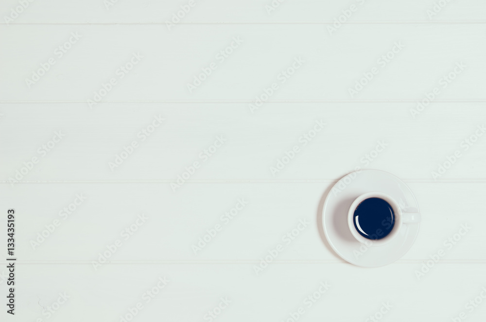 Coffee mug on white wooden table top view. Filtered vintage effect photograph Coffee mug on white wooden table top view. Filtered vintage effect photograph