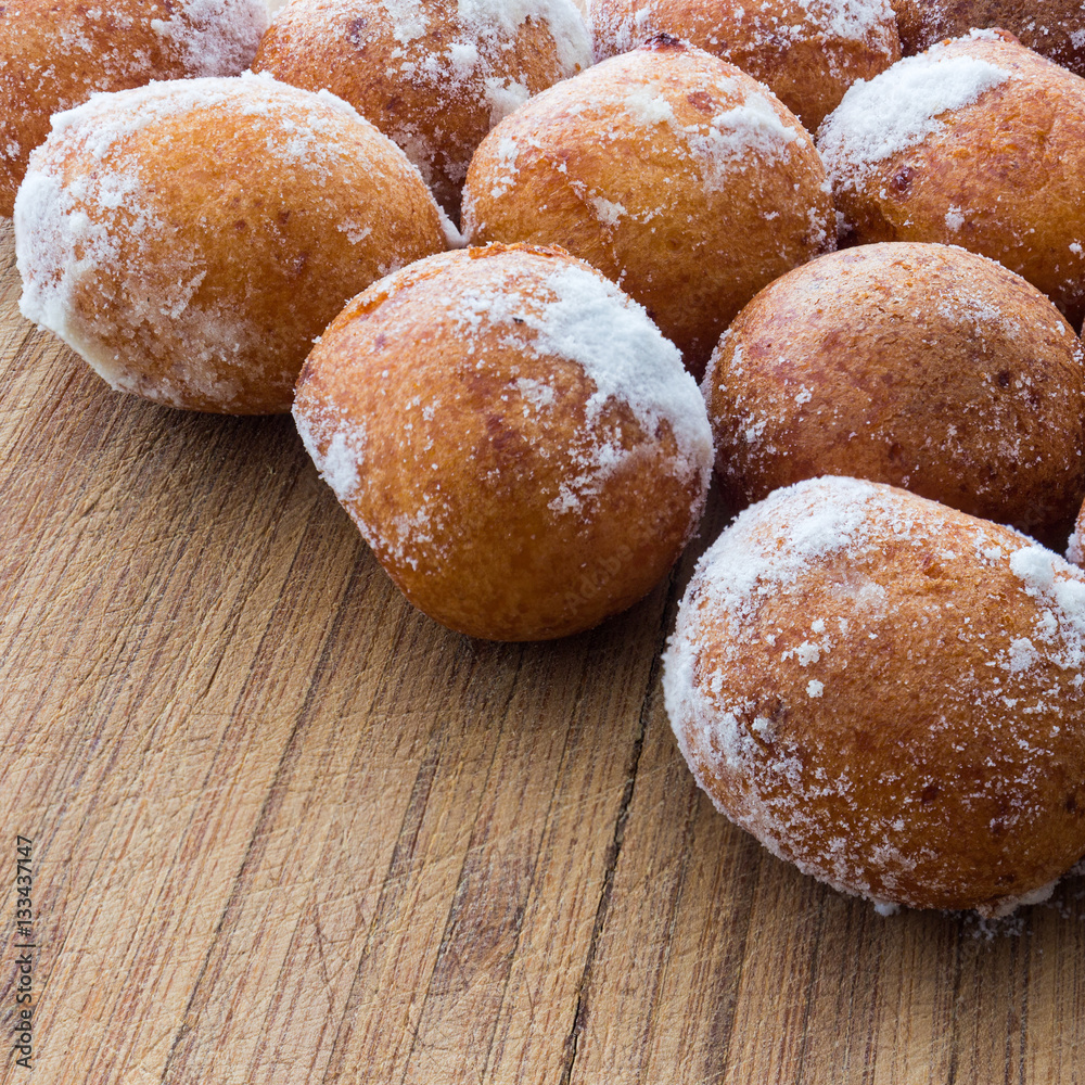Round doughnuts dusted with powdered sugar Round doughnuts dusted with powdered sugar